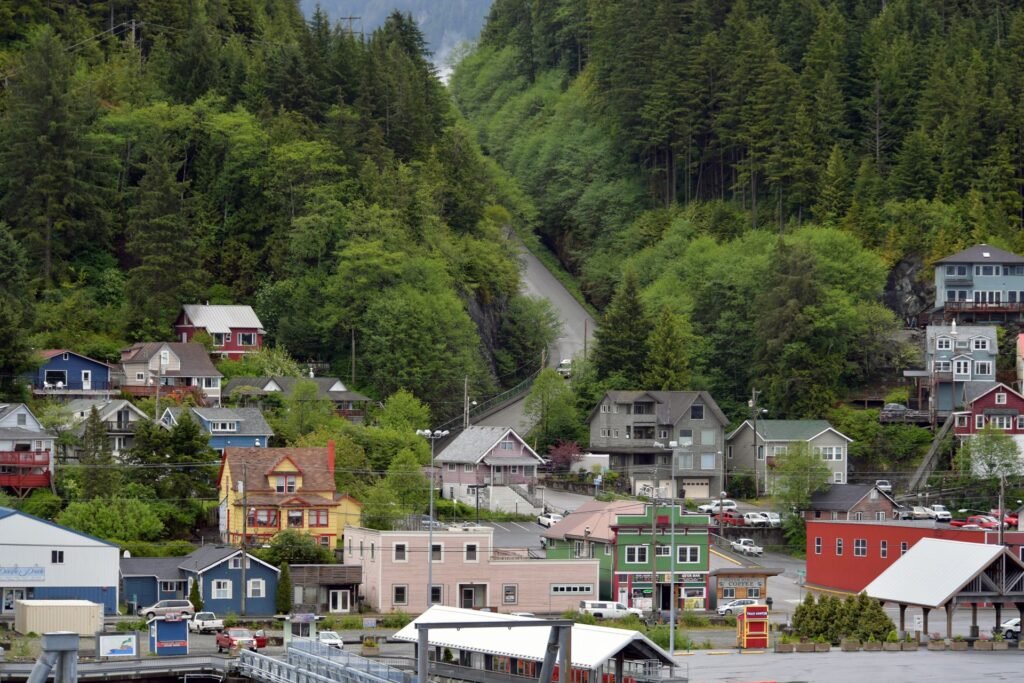 An Alaska cruise ports guide view of Ketchikan's waterfront town and forested hillside