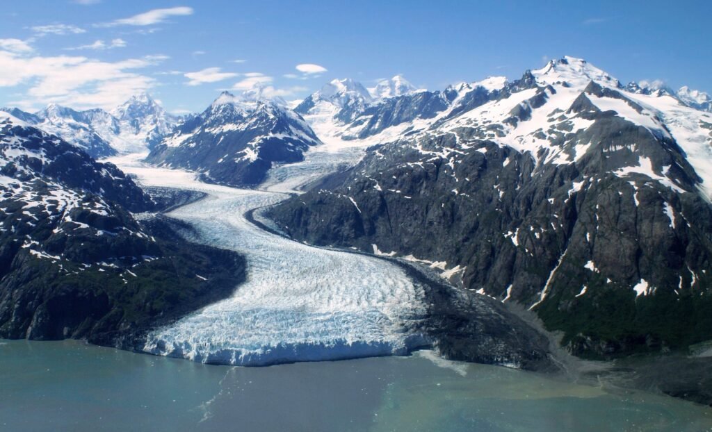 Aerial view of Margerie Glacier winding through the mountains in Glacier Bay, Alaska