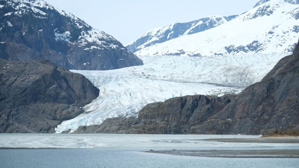 mendenhall-glacier-juneau-alaska Mendenhall Glacier descending its valley to the lake near Juneau, Alaska, reachable from the cruise port for the cost of a bus ticket